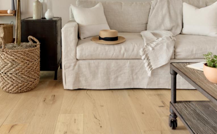 warm toned wood look flooring in boho living room.