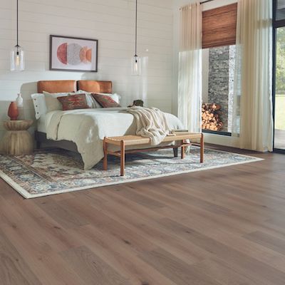 wood look laminate floors in a rustic cozy bedroom